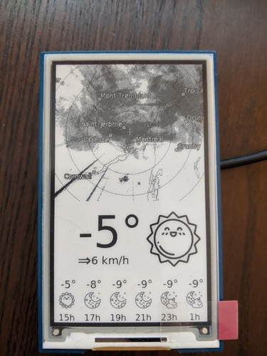 Progress photo with weather conditions rendered to the display, including smiling sun and sleep moon icons